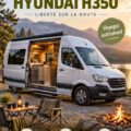 Un Hyundai H350 aménagé en van sur une route pittoresque.